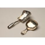 A LATE GEORGE III SILVER CADDY SPOON, maker Joseph Taylor, Birmingham 1812, in Fiddle pattern, the