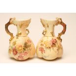 A PAIR OF ROYAL WORCESTER CHINA "CORAL" HANDLED JUGS, 1896, of lobed form with shaped rims,