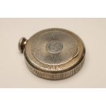 A FRENCH ART DECO COMPACT/SCENT FLASK, apparently unmarked, of circular form with engraved sunburst,