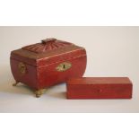 A REGENCY RED CRUSHED MOROCCO LEATHER CASKET, of sarcophagus form with gilt tooled border and