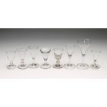 A COLLECTION OF EIGHT GEORGIAN AND LATER DRINKING GLASSES, including a wine with funnel bowl and