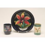 TWO MOORCROFT POTTERY SMALL POTS, c.1960, one of cylindrical form in the Columbine pattern on an