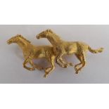 A fine quality 9ct gold brooch two galloping horses 20.3 gms Birmingham A & W