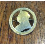 Cut sovereign brooch with queen Victoria's profile.