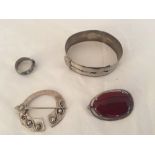 Silver jewellery including bracelet, brooches and ring.