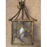 Faux bamboo brass light fitting.