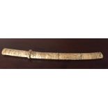 Japanese sectinal ivory sword and scabbard carved with figures in a landscape 47cm long