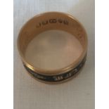 An 18ct gold mourning ring 4.9gms approximately.