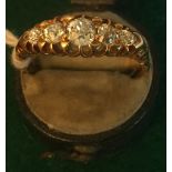 Eighteen carat gold ring set with five graduated diamonds. Size S.