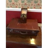 Vintage leather suitcase and a crystal receiver