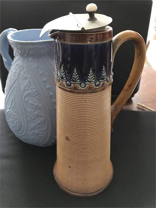 Doulton Lambeth stoneware jug and moulded pottery jug