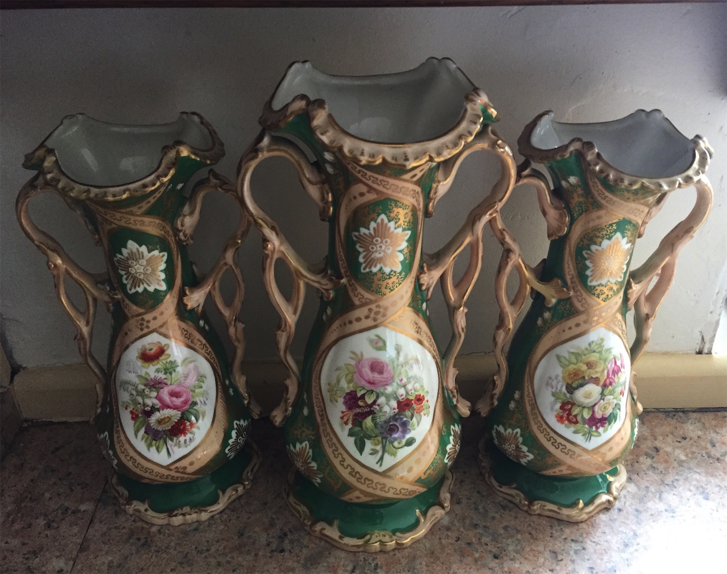 Garniture of mid 19th c porcelain vases one with repair to top