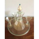 Murano glass decanter and four glasses on tray with gold mica flecks and air twist stems