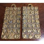 Two brass alphabet plaques inscribed to back St Pauls 1729