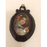 Good quality Whitby jet brooch with finely painted portrait of a lady.