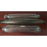 Three clear glass rolling pins