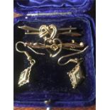 Two 9ct gold brooches and a pair of earrings