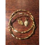 Two Saudi Arabian yellow metal bangles and a pair of earrings 28.2 gms