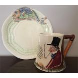 Clarice Cliff moulded plate with fish decoration and a Crown Devon musical jug