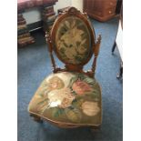 Mid 19th c walnut nursing chair with original Berlin wool work upholstery