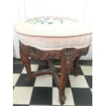 Carved walnut circular stool