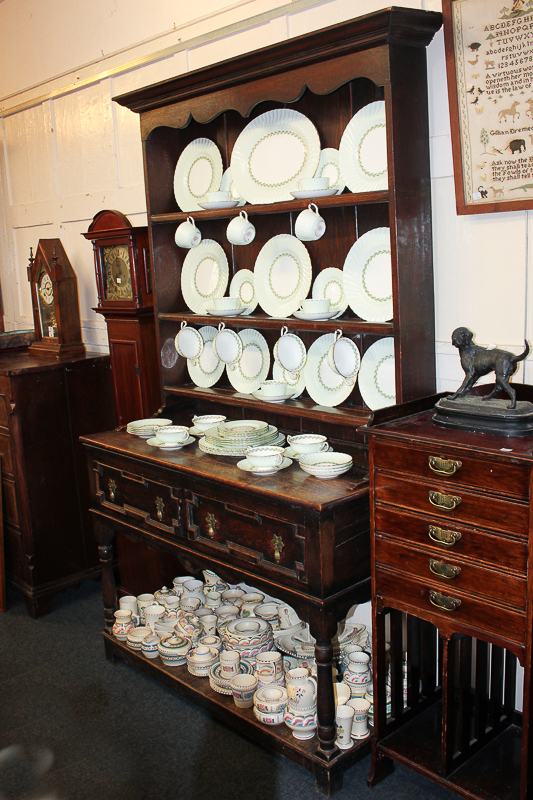 A 20th century oak dresser with three-shelf back above two drawers and pot shelf with turned