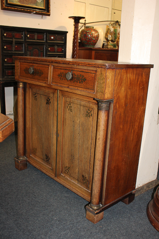 A Regency rosewood and brass inlaid chiffonier with two inlaid drawers above cupboard flanked by