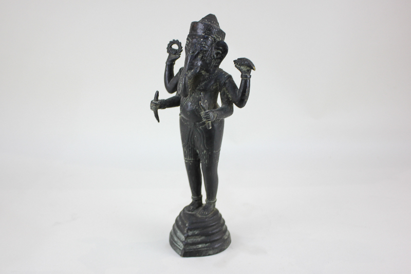 A bronze figure of the Indian deity Ganesh, possibly Cambodian, 30cm high