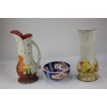 Two similar Diana Wilton pottery jugs, one depicting rabbits looking at a night sky, the other