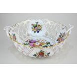 A Herend Hungarian porcelain basket of pierced form with intertwined leaf scroll handles, in the