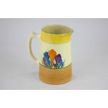 A Clarice Cliff Crocus pattern pottery jug, in the Bizarre range for Newport Pottery, 13cm high