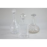 A glass spirit decanter with etched design of the Mary Rose, together with two other glass