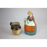 A Royal Doulton small stoneware jug, 9cm, and a Potter and Moore porcelain lavender lady box, 19cm