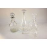 Three various glass decanters and a glass funnel