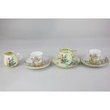 A pair of Shelley china nursery cups and saucers decorated with children and a goat on a bridge, a