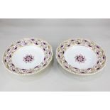 A pair of Bloor Derby bowls with gilt and puce scroll borders, crown mark to base, 26cm