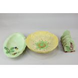 Three items of Carlton ware to include a toast rack, circular floral dish, and an oval dish, 22cm