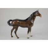 A Beswick porcelain swish tail horse first version model 1182 in brown gloss