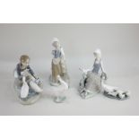 Two Lladro porcelain figures of girls, one with geese, one with a dove, together with a Lladro goose