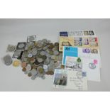 A collection of foreign coinage commemorative crowns and first day covers