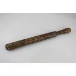 An early 19th century painted wooden truncheon with distressed coat of arms and initials JS, 46cm