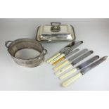 A silver plated rectangular entree dish, seven various knives including a Mappin & Webb carving