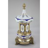 A 20th century Italian porcelain and gilt metal musical cigarette dispenser, 40cm high