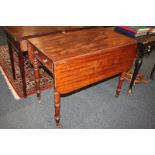 A mahogany Pembroke table with two drop flaps, drawer and opposing dummy drawer, on turned legs