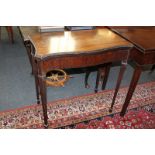 A mahogany card table with folding shaped rectangular top, on tapered legs and spade feet, 75.