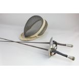 A pair of fencing foils, 102cm, and a face guard