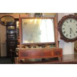 A 19th century inlaid mahogany bow front dressing table mirror with box base, three drawers, on