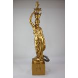 A gilt plaster figural table lamp, 70cm high