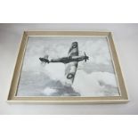 A framed black and white photograph of a Hawker Hurricane fighter aircraft in flight, 'The Last of