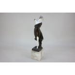 An Art Deco bronze and ivory figure by G Moerlin, of a classical female figure in robes, standing on